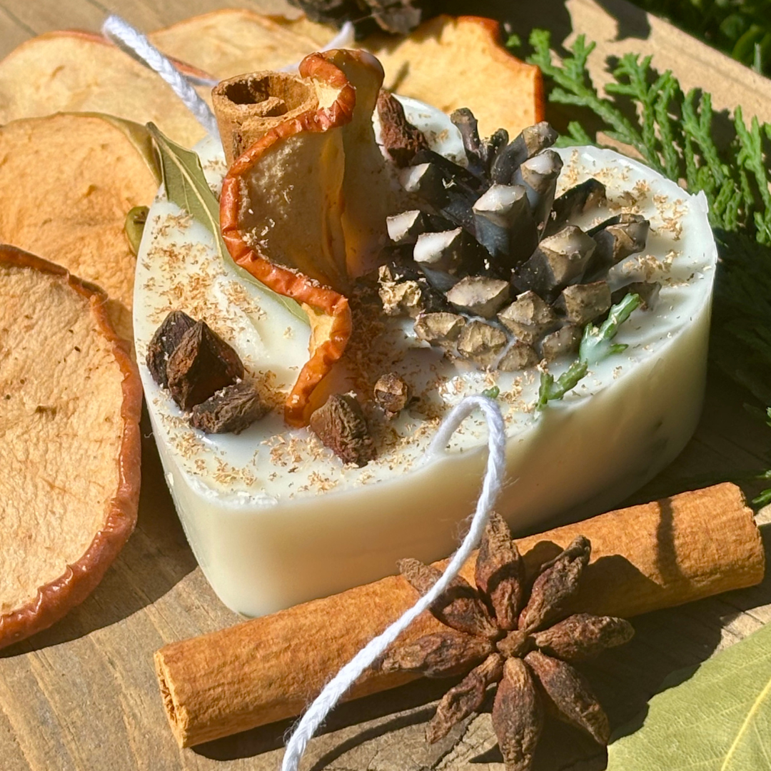 Decorative soap with natural elements on a wooden surface